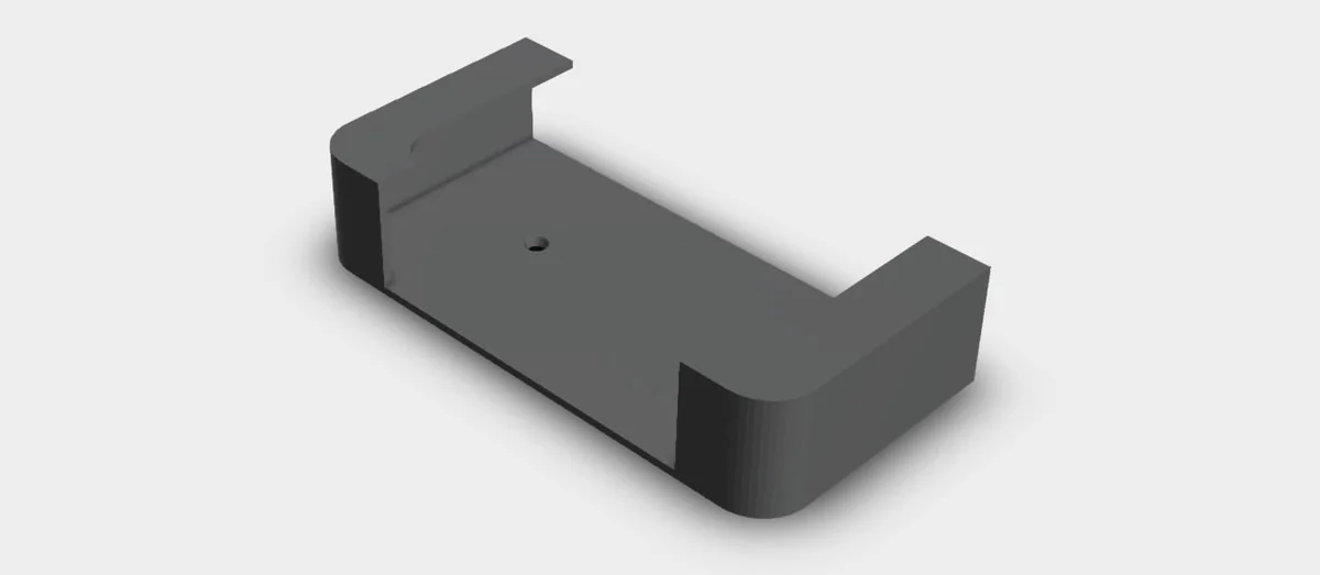 The 3D model of the wall mount: a flat plate with a raised block at both ends