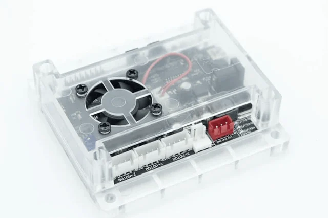 The controller board with a fan in a transparent case