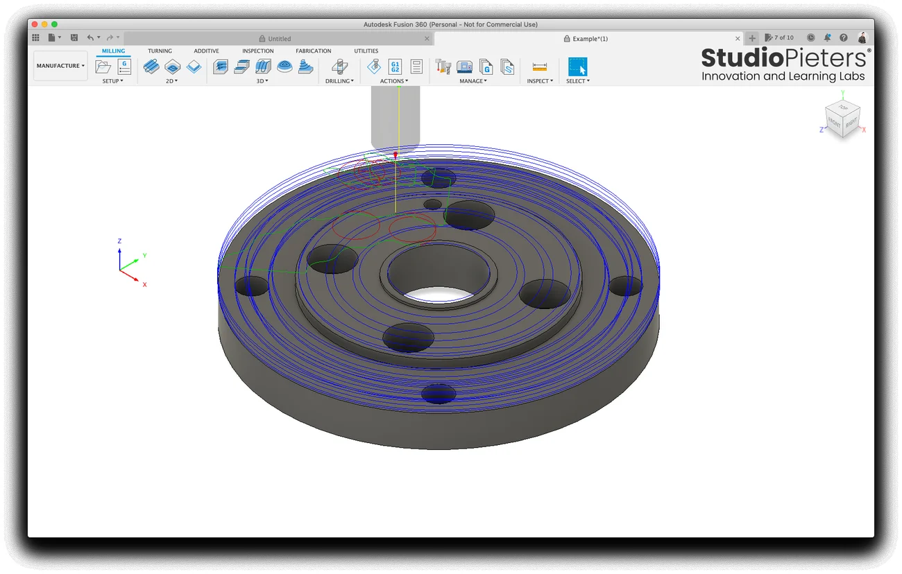 The toolpath of the pocket drawn in blue over the flange