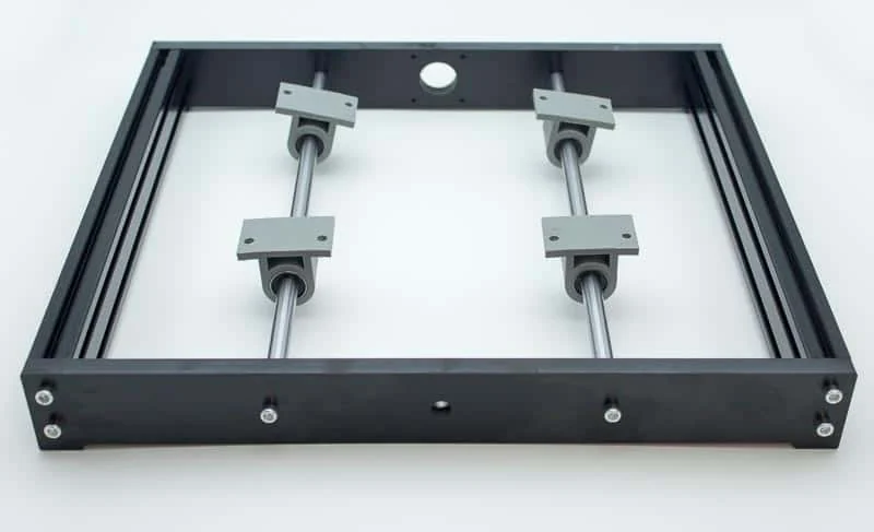 The black frame with two rods and four bearing holders