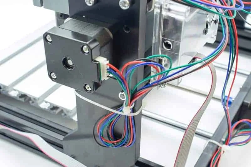 The tied cables at the stepper motor of the gantry