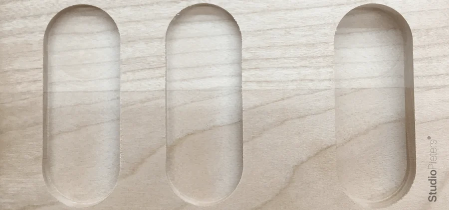 Three slots cut in wood with a straight flute bit