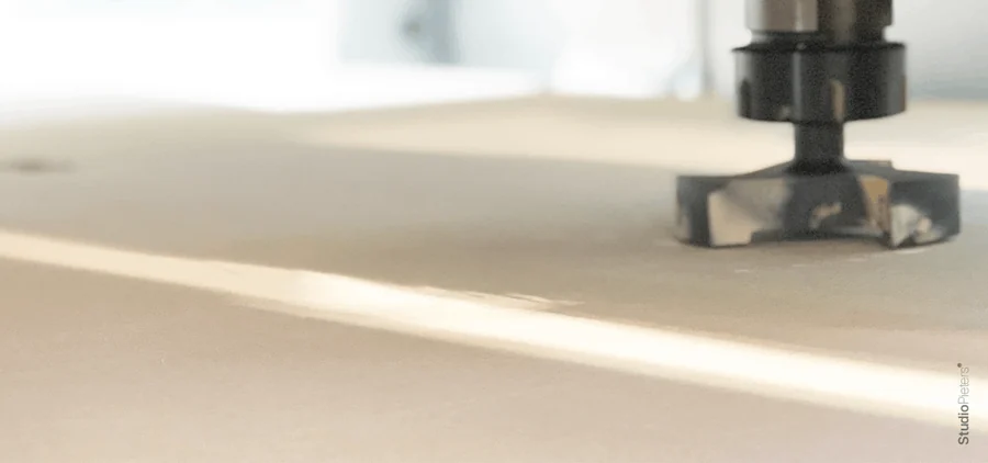 A surfacing bit levelling a board