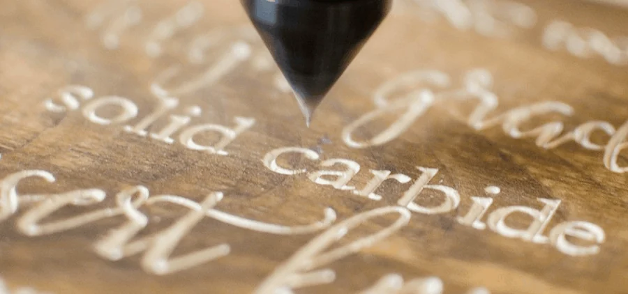 Letters engraved in wood with a V-groove bit