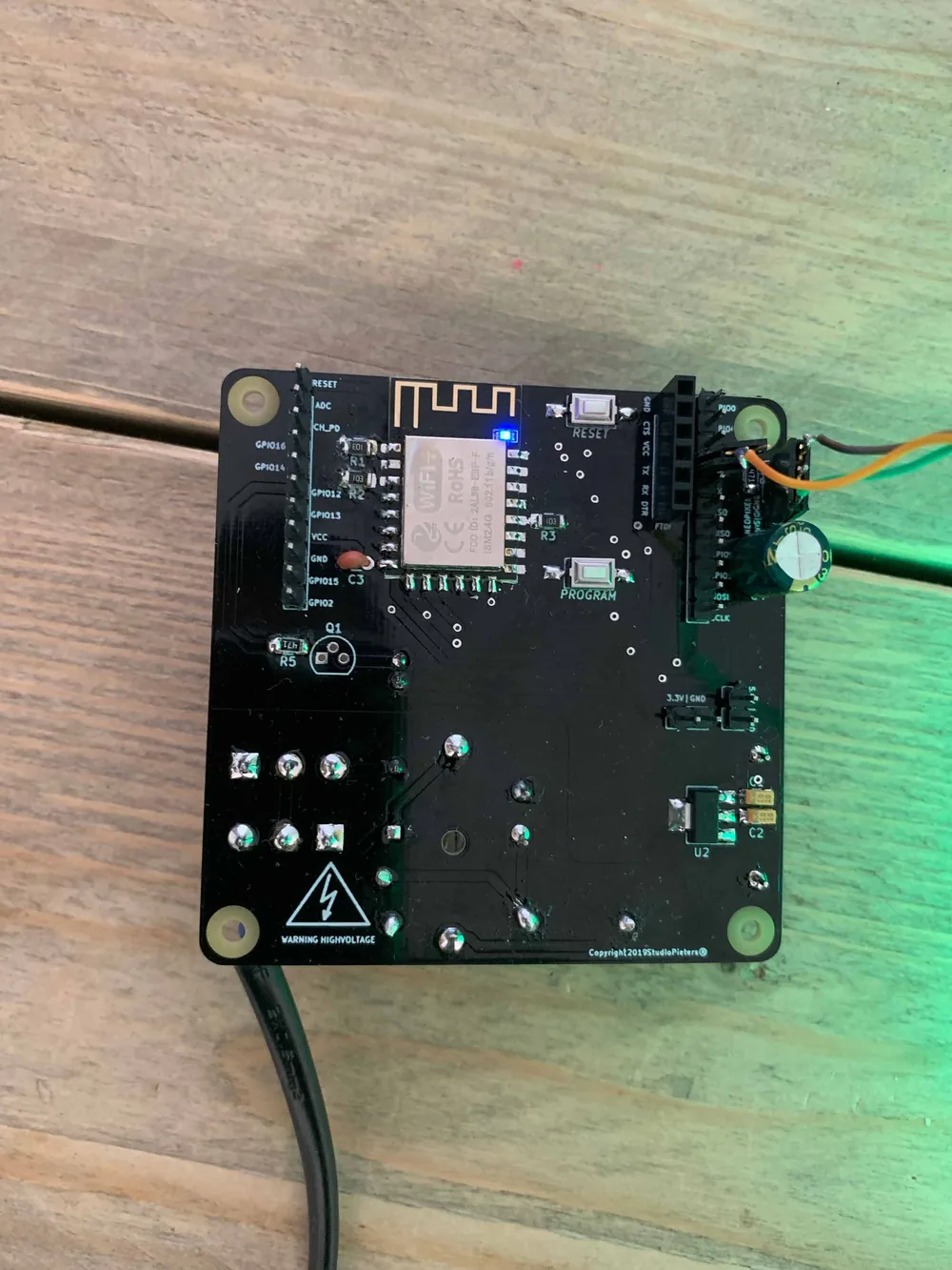 The assembled controller board powered on during testing