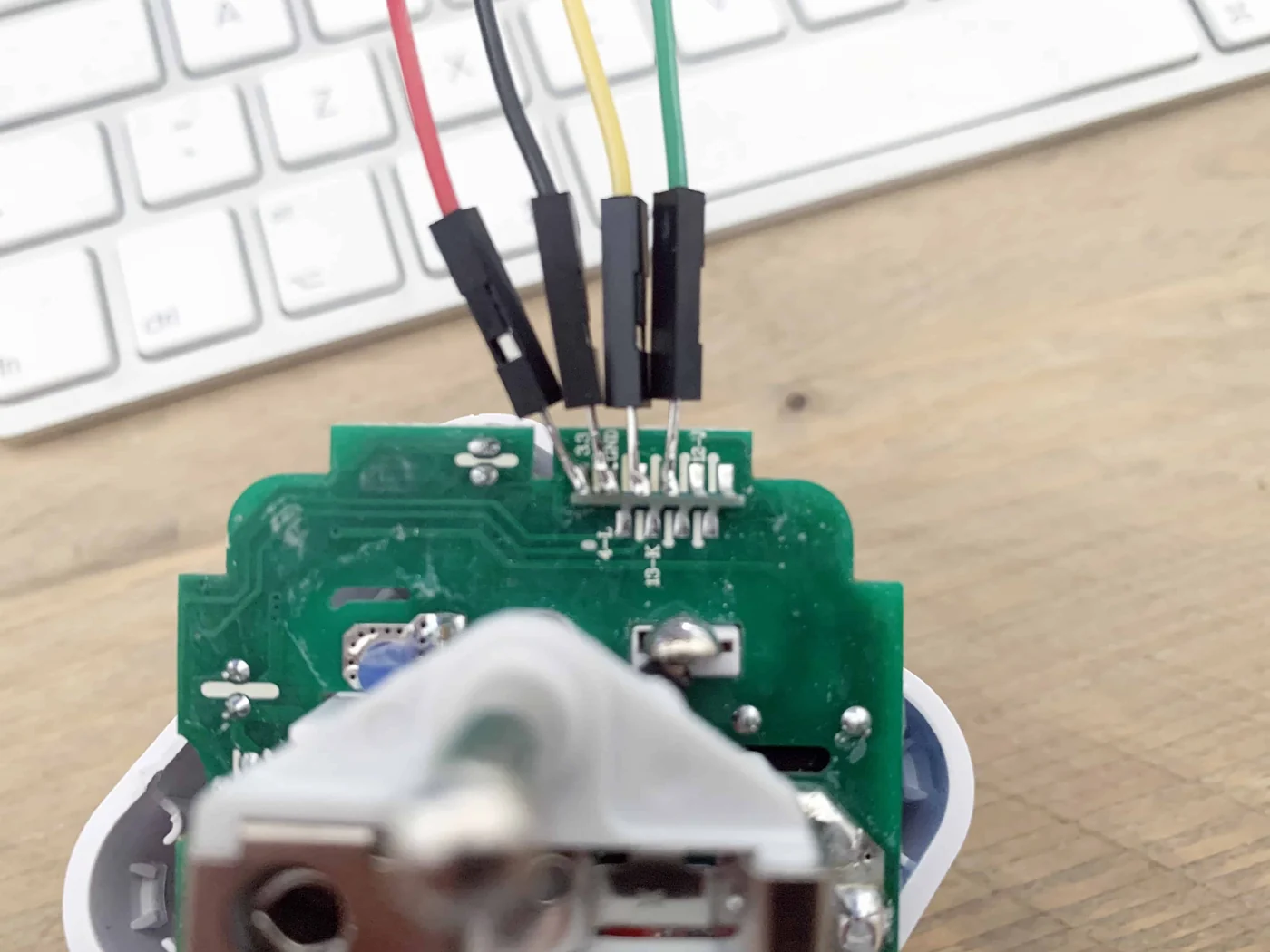 Four wires soldered to the pads of the module on the open plug