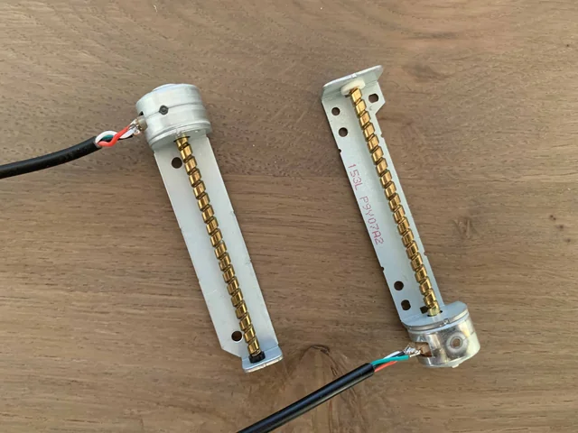 Two small stepper motors with a threaded rod