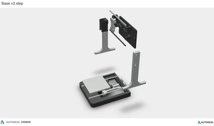 An exploded render of the engraver showing the base, the frame and the laser holder