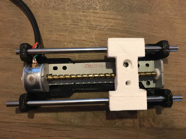 A printed slider on two rods with the stepper motor