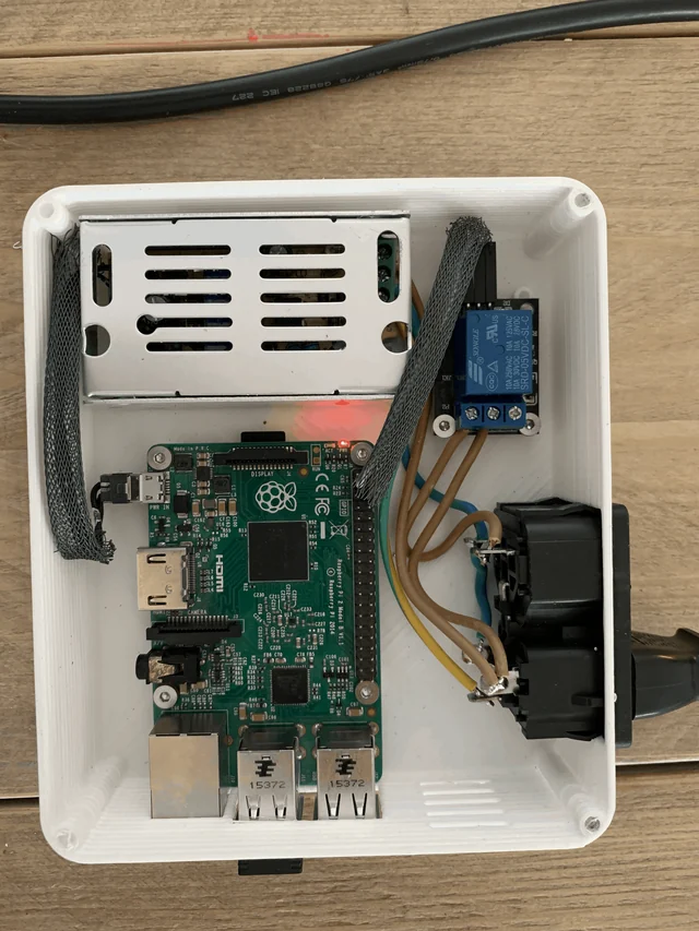 The same build with the Raspberry Pi switched on and its red led lit