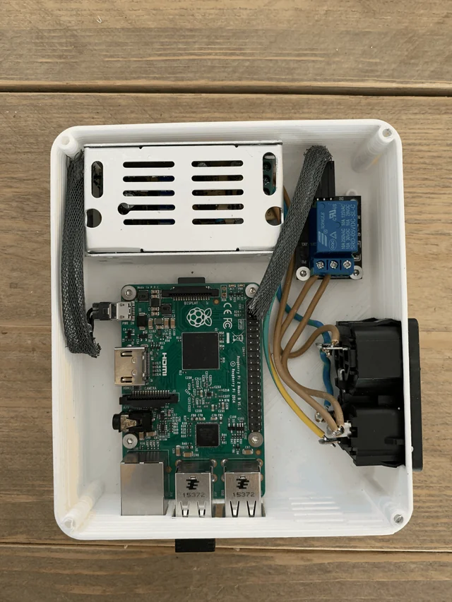 The base with the Raspberry Pi, the relay module and the wiring fitted